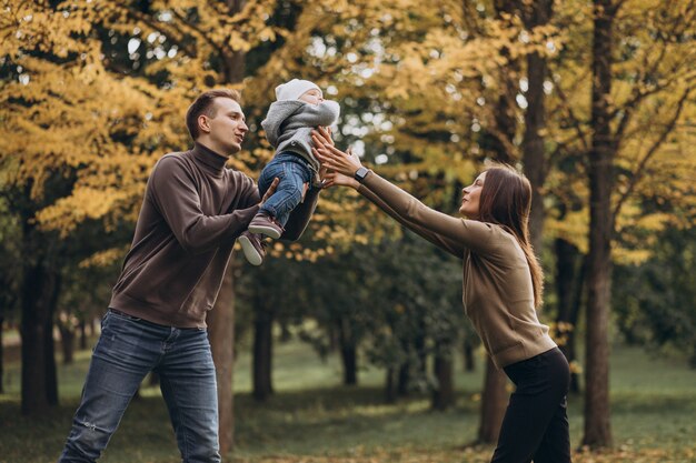 Young family with baby son in park