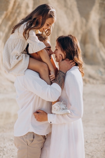 Young family with daughter walking out together