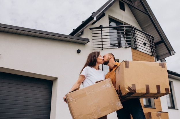 Free photo young family with little daughter moving into new house