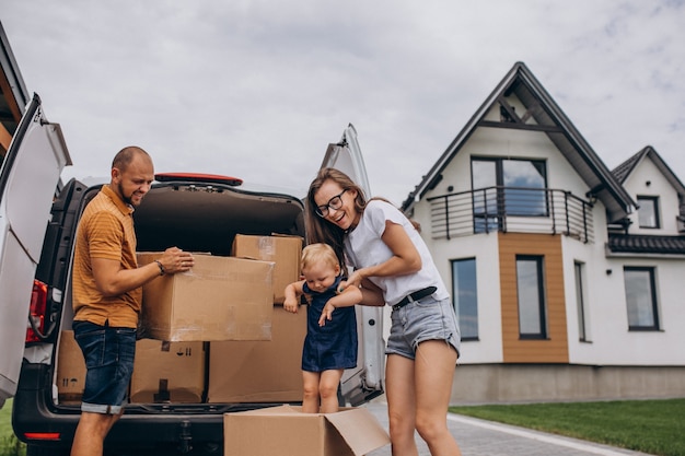 Young family with little daughter moving into new house