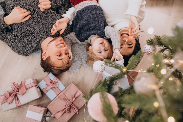 Free Photo young family with little son under the christmas tree