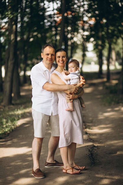 Young family with little son in park