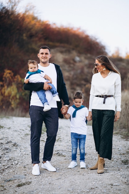 Young family with two sons together outside the park