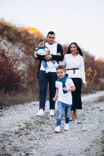 Young family with two sons together outside the park