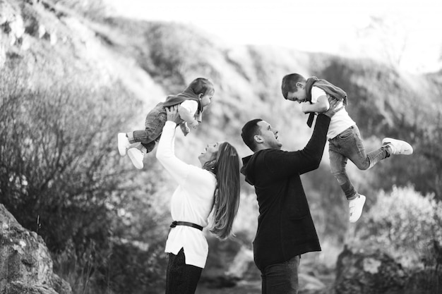 Young family with two sons together outside the park