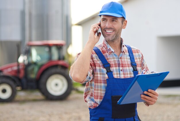 Young farmer taking care of his business