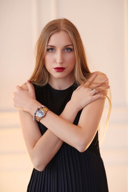 Young fashion woman posing with black dress