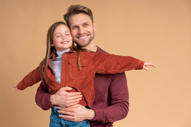 Young father and daughter playing together before traveling