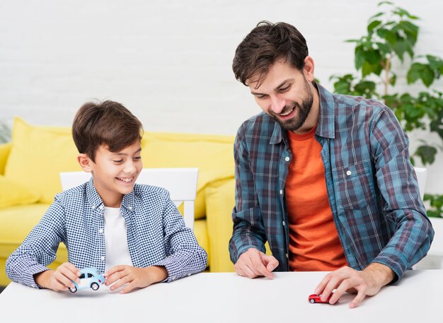 Young father playing with his boy