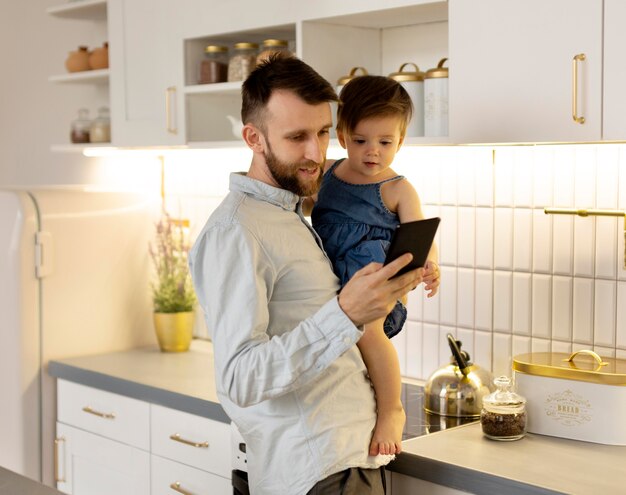 Young father spending time with his adorable daughter