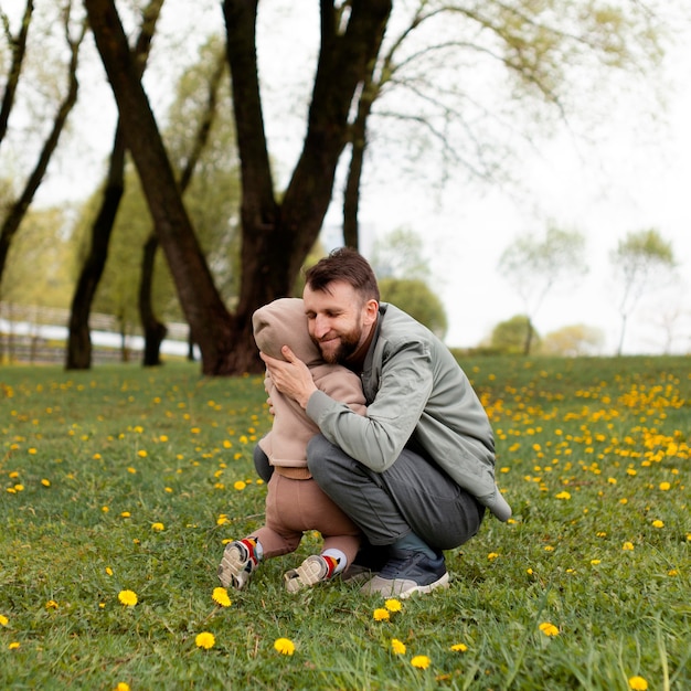 Young father spending time with his adorable daughter