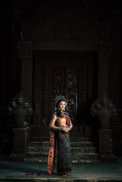 Young female Actress wearing beautiful ancient costumes, in ancient monuments, dramatic style. Perform on legend love popular story, Thai Isan folktale called "Phadaeng and Nang-ai" in acient site