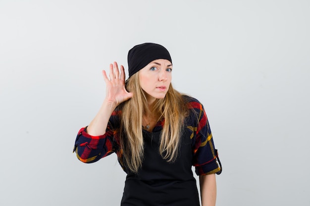 Free photo young female cook in a black apron