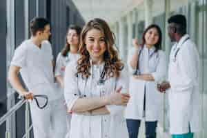 Free photo young female doctor posing in the corridor of the hospital