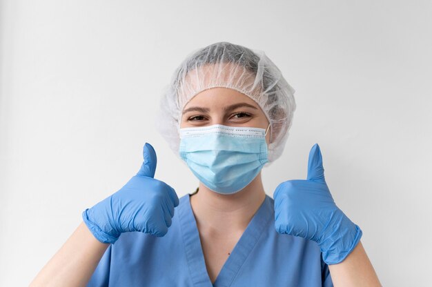 Young female doctor wearing a protective equipment