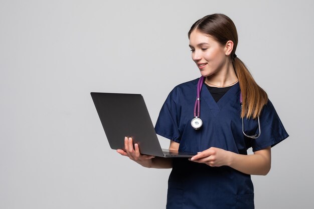 young female doctor working isolated on white