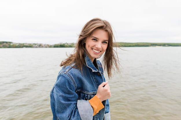 Young female enjoying sea breeze