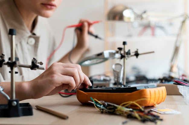 Young female inventor creating in her workshop