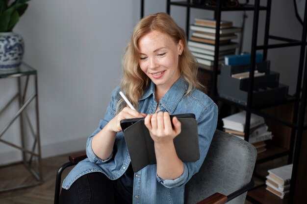 Young female logo designer working on a graphic tablet