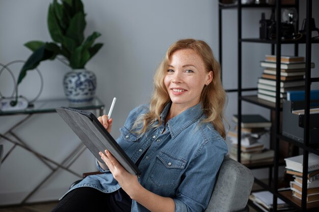 Young female logo designer working on a graphic tablet