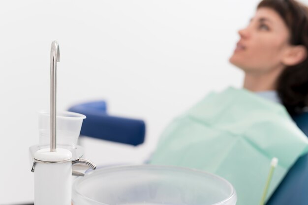 Young female patient waiting to have dental procedure at the dentist