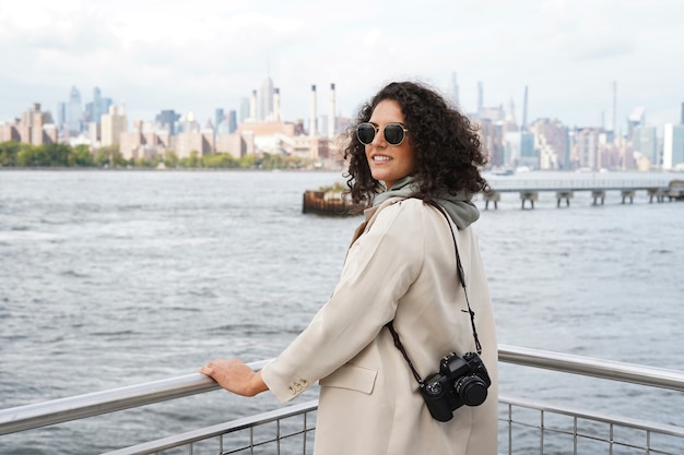 Young female photographer exploring the city with her camera