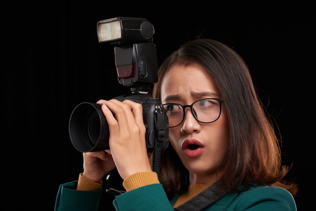 Young female photographer is shoked what content she is going to shoot