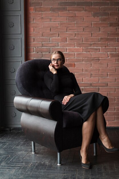 Young female sitting on couch