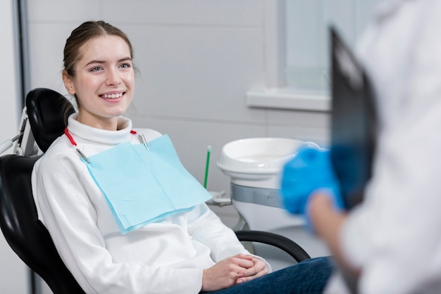 Young female smiling at the dentist