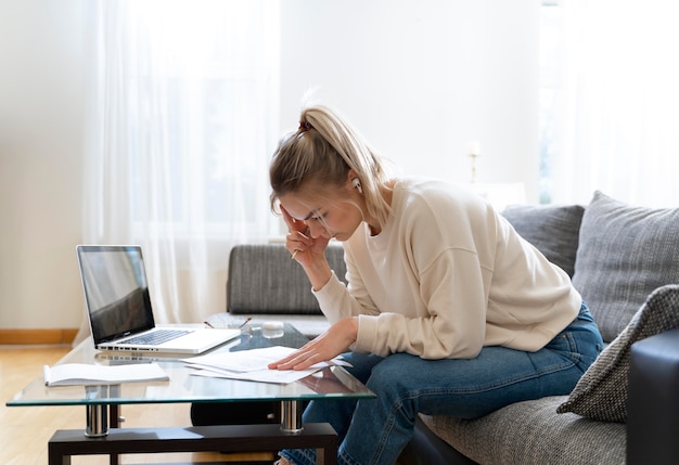 Young female student listening to her english teacher