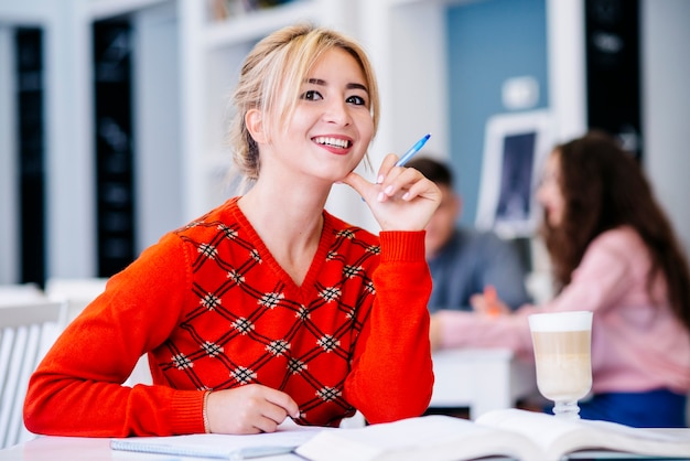 Young female studying and smiling