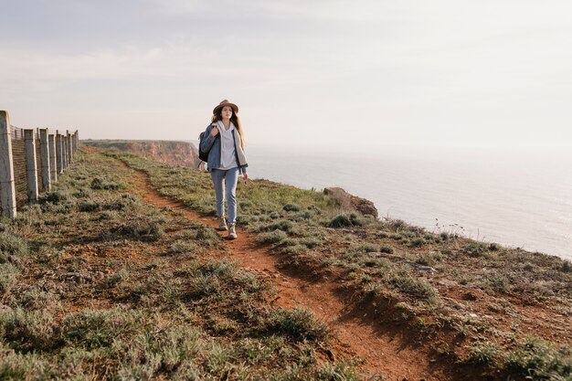 Young female traveler enjoying the peace around her