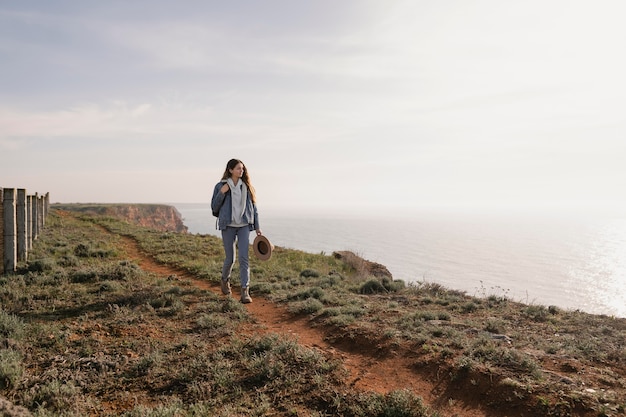 Young female traveler enjoying the peace around her