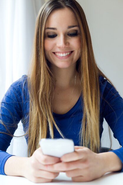 "Young female using smart phone."