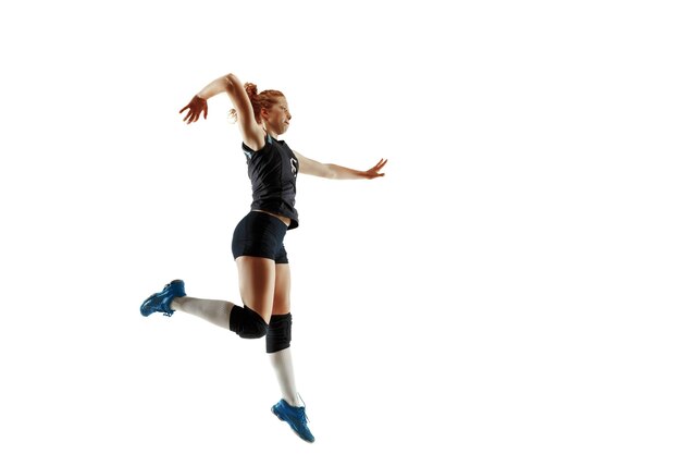 Young female volleyball player isolated on white  background.