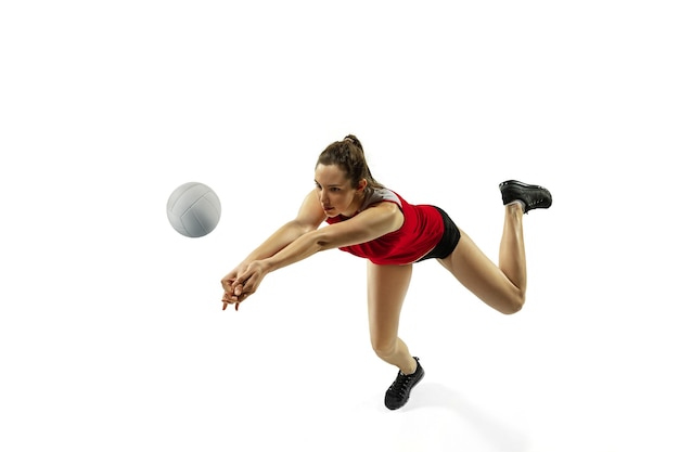 Young female volleyball player isolated on white  background.