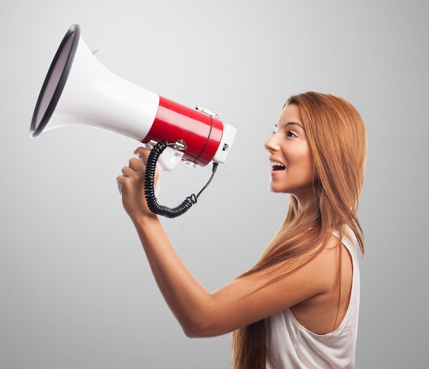 Young femaly shouting in speaker