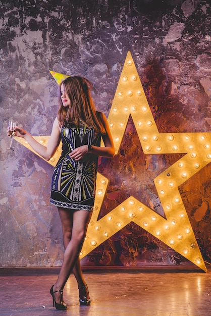 Young festive girl with champagne