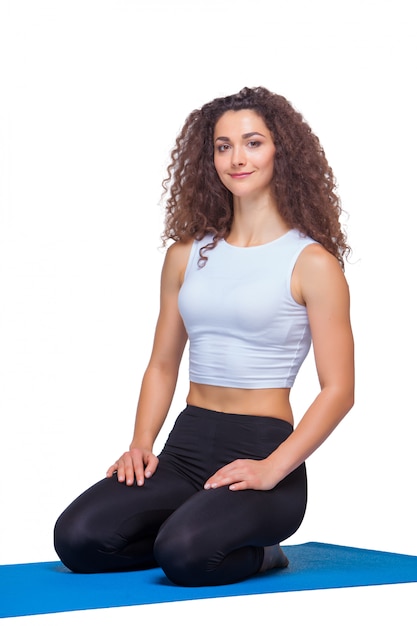 Free photo young fit woman after yoga exercises.