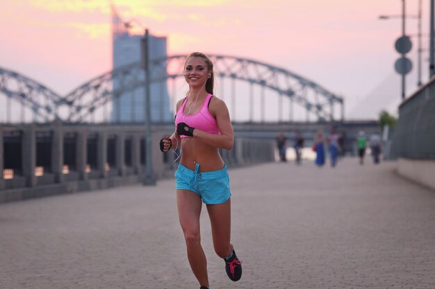 Young fit woman in sportswear outdoors