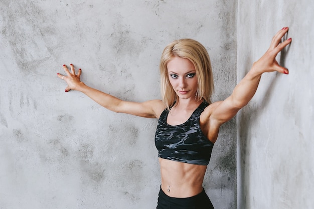 Young fit woman in sportswear