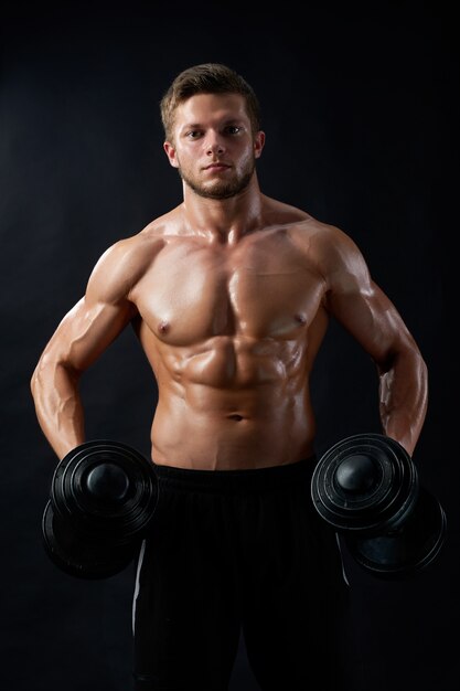 Young fitness man in studio