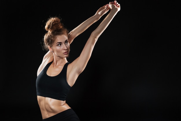 Young Fitness woman doing yoga exercises