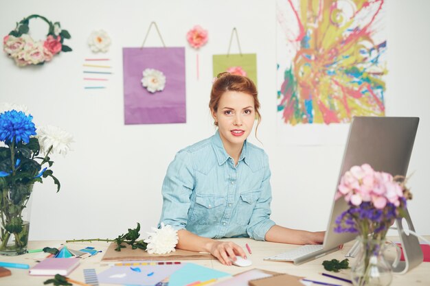 Young florist at workplace