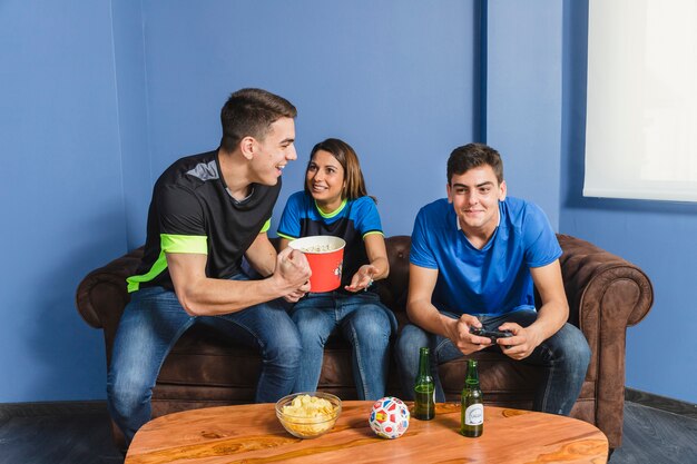 Young football fans in living room