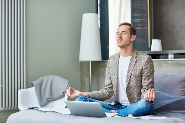 Young Freelancer Practicing Yoga