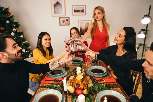 Young friends dining at christmas