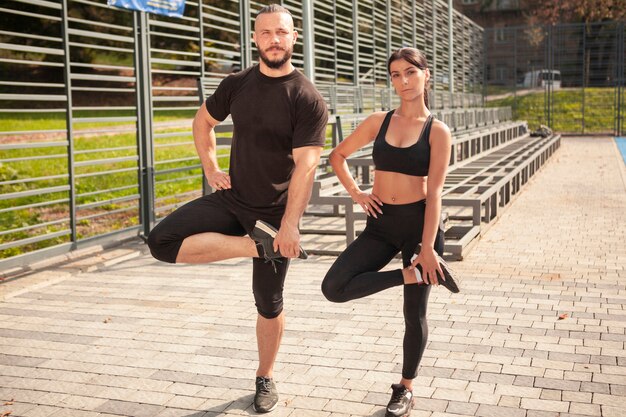 Young friends doing one leg position together