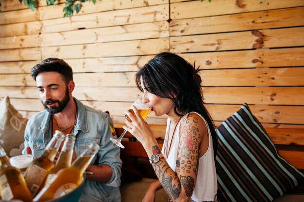 Young friends drinking beer