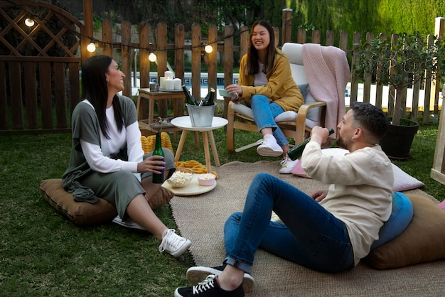 Young friends having fun at cinema in open air